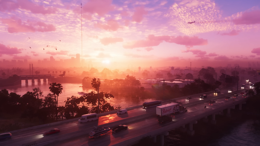 Záber na cestu s autami a východ slnka, screenshot z traileru na hru GTA VI