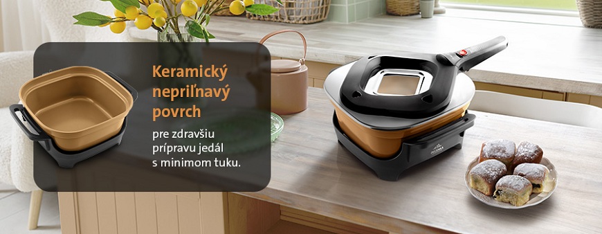 Pečenky ETA Ceramic Natura: Keď pečenie hrá farbami Elektrický hrniec na pečenie ETA PEČENKA s béžovým keramickým nepriľnavým povrchom pre zdravšie varenie s minimom tuku postavený na jedálenskom stole vedľa Honzových buchiet