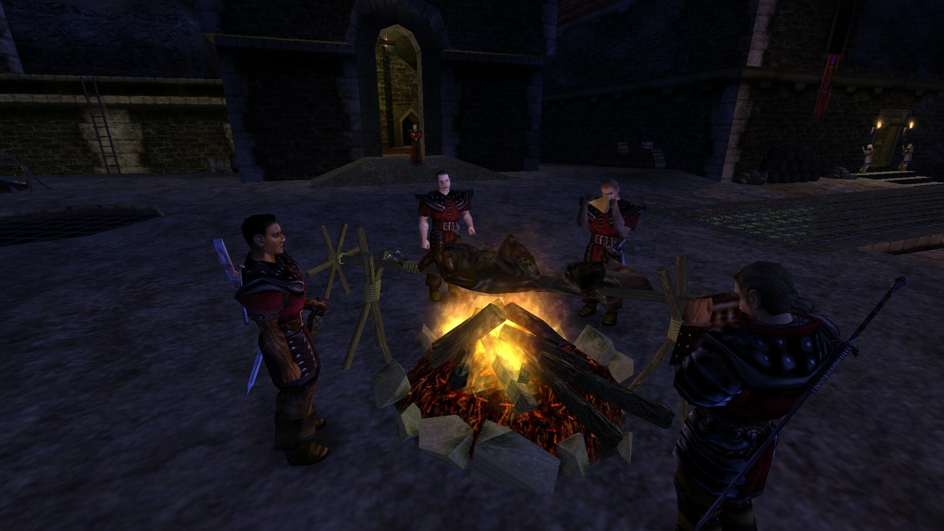 Screenshot z hry Gothic 1, štyri postavy stoja okolo ohniska