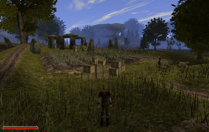 Screenshot z hry Gothic 2 - hrdina stojí uprostred krajiny pred kamennými monolitmi
