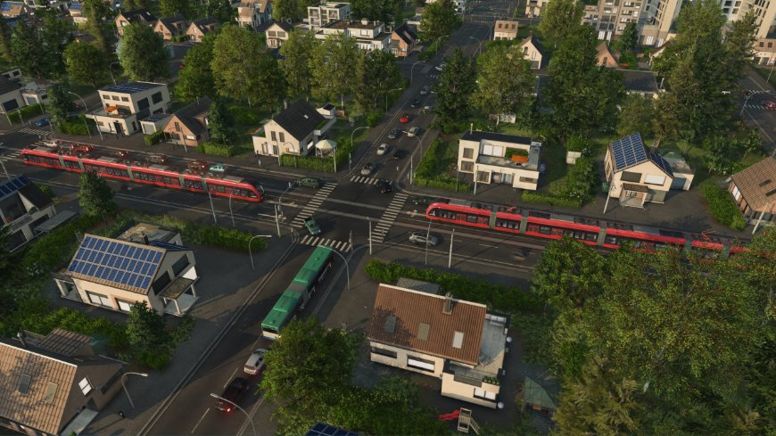 Železničná trať vedúca mestom z výšky, na dráhe ide vlak, záber z hry Transport Fever 3