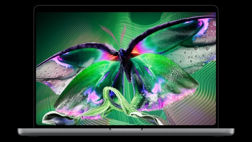 Láska na prvý PROLED! Apple do tretice všetkého nového predstavil prvý dotykový MacBook Pro MacBook Pro s PROLED XDR displejom, na ktorom je vyobrazený kontrastne sfarbený motýľ