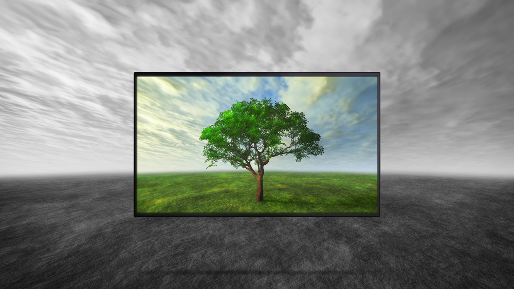 Rám televízora na šedom pozadí zobrazujúci zelenú krajinu a strom.